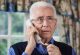 Worried Senior Man Answering Telephone At Home Worried Senior Man Answering Telephone At Home