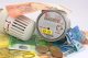 Zähler, Thermostat und Geld Zähler, Thermostat und Geld
